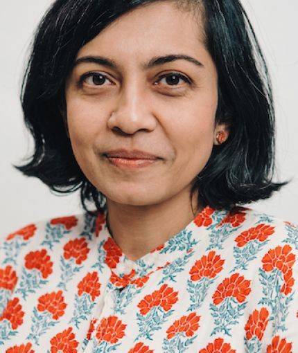 woman with shoulder-length black hair. 