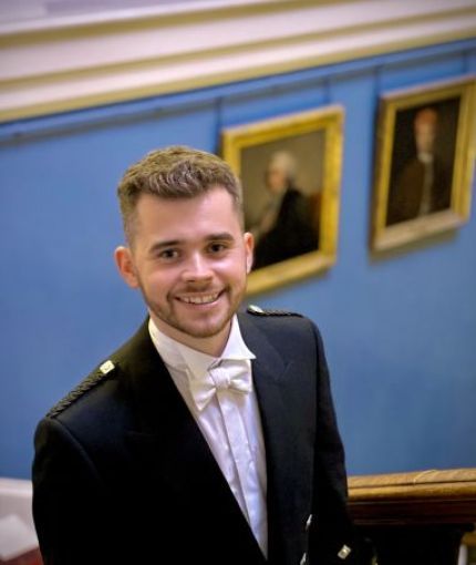 Photo of Stewart Duncan pictured at the entrance to Playfair Library, Old College, University of Edinburgh 