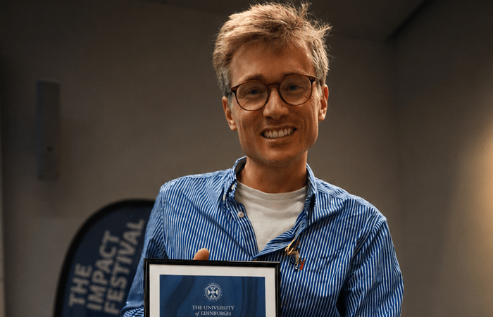 Dr Ben Kasstan-Dabush receiving his Research Impact Prize