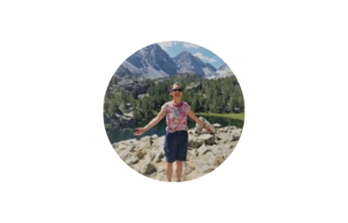 Small image of Elizabeth Bomberg in nature, beside the EUSA Teaching Awards logo