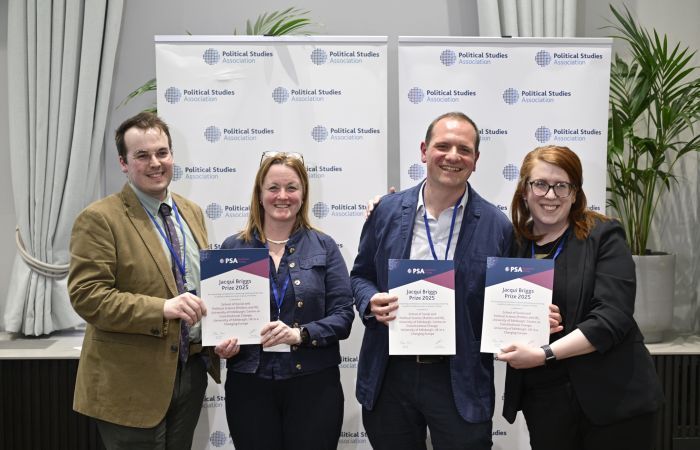 Photo of four SPS academics - Fraser McMillan, Ailsa Henderson, Davide Vampa and Meryl Kenny - with their prizes