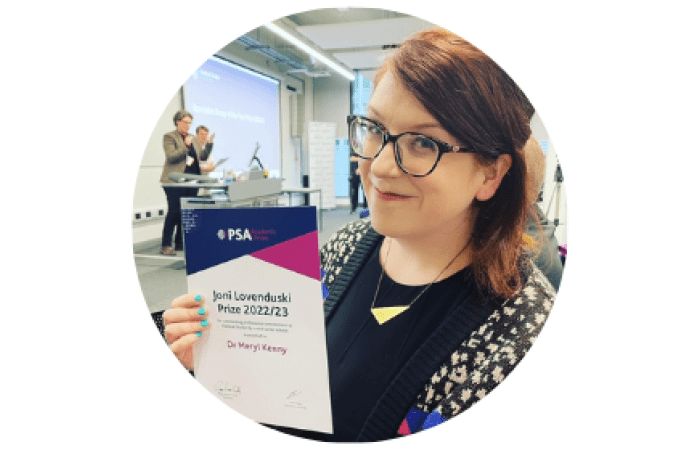Meryl Kenny holding the Joni Lovenduski prize certificate