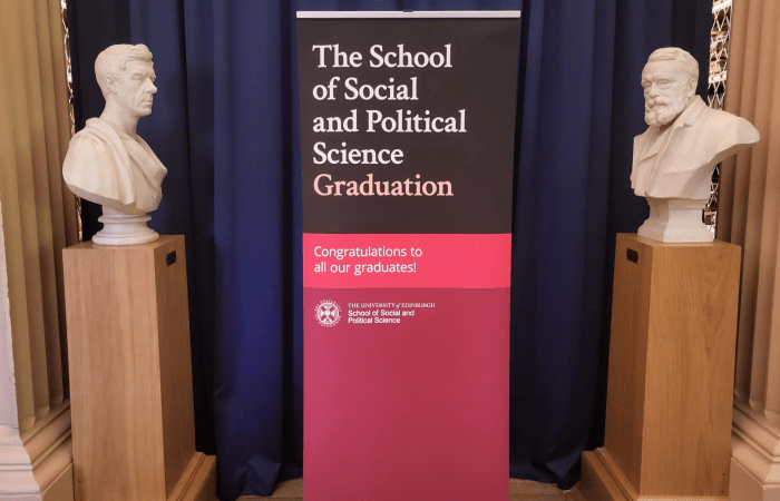 Image of a pop-up banner that says 'The School of Social and Political Science Graduation'