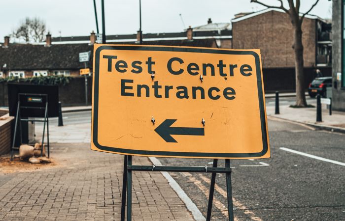 Road sign reading Test Centre Entrance
