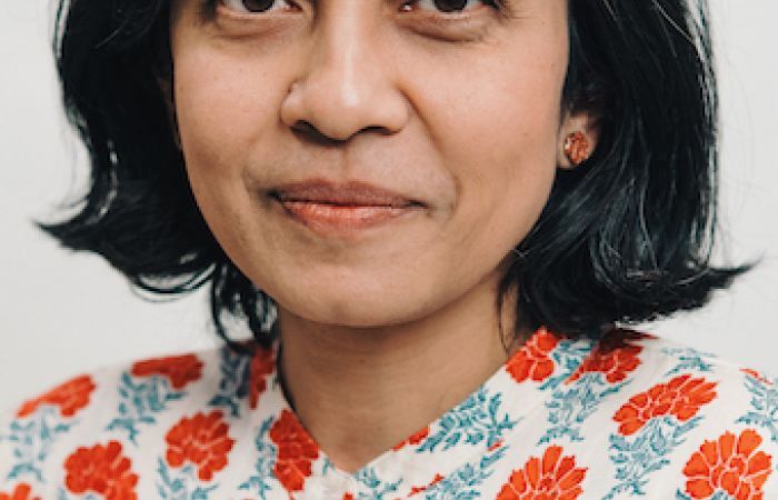 woman with shoulder-length black hair. 