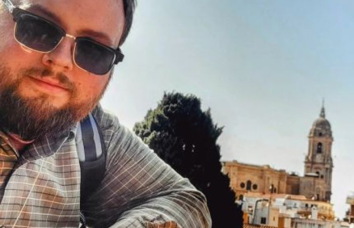 John Parker leaning against a wall in the Alcazaba de Malaga