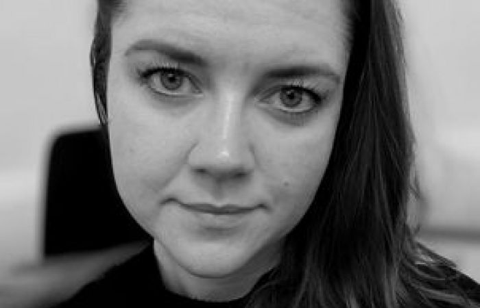 Profile picture in black and white of Sofie Illemann Jaeger. Sofie has long, dark hair and is wearing a black dress.